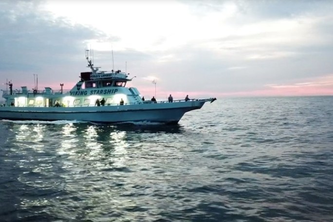 a small boat in a large body of water