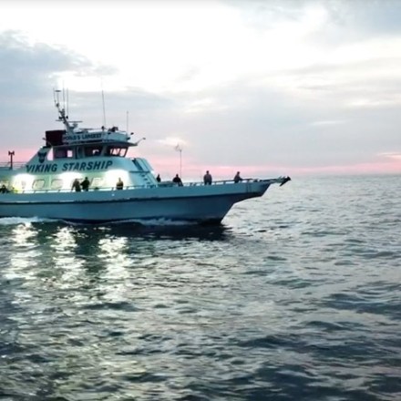 a small boat in a large body of water