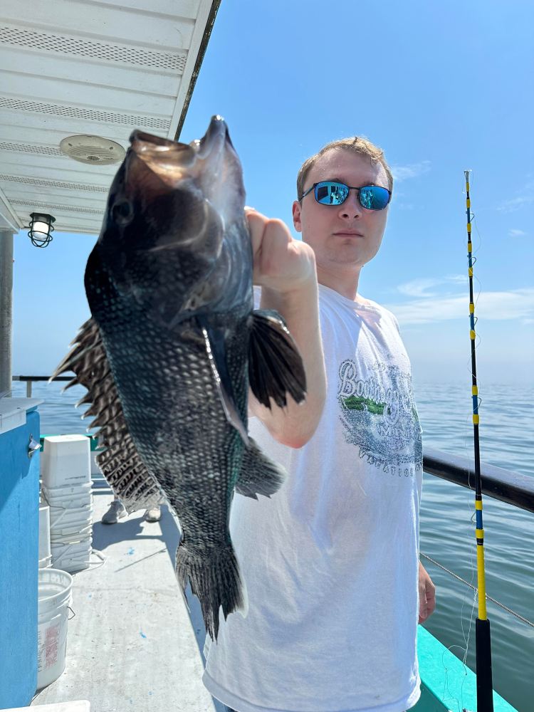 a person holding a fish