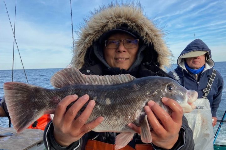 a person holding a fish