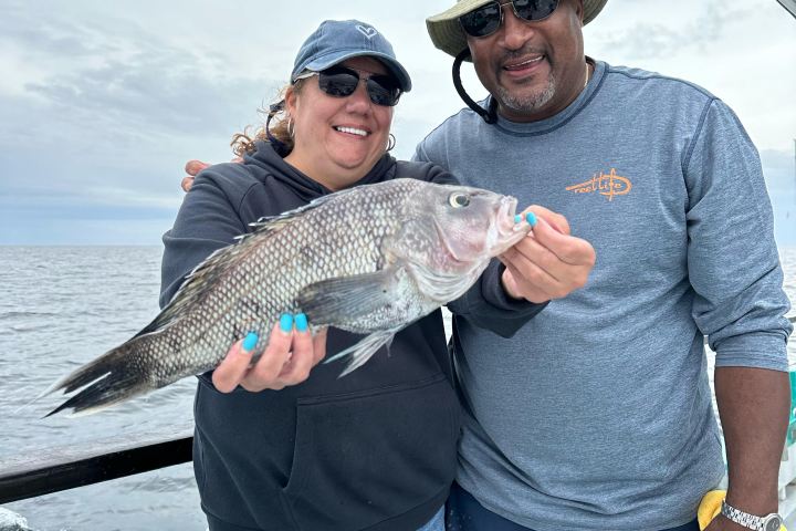 a person holding a fish