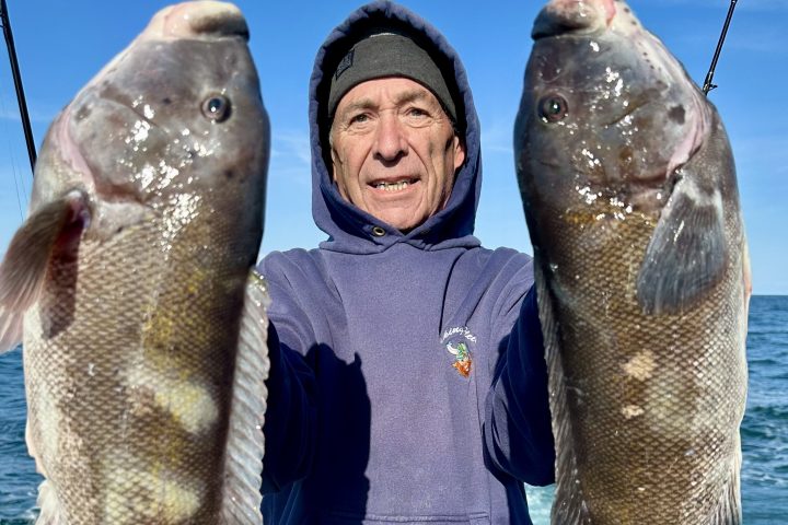 a man holding a fish