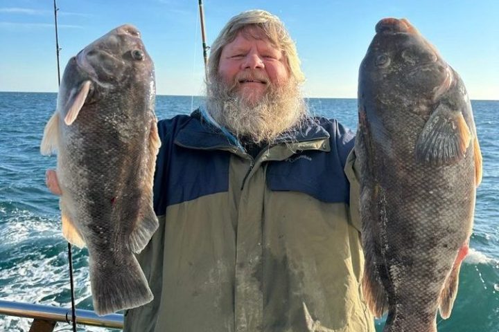 a man holding a fish