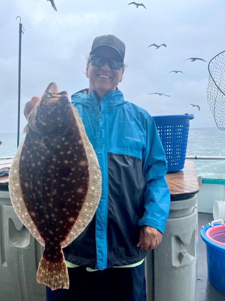 a person holding a fish