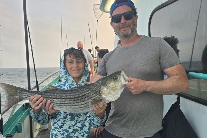 a man holding a fish