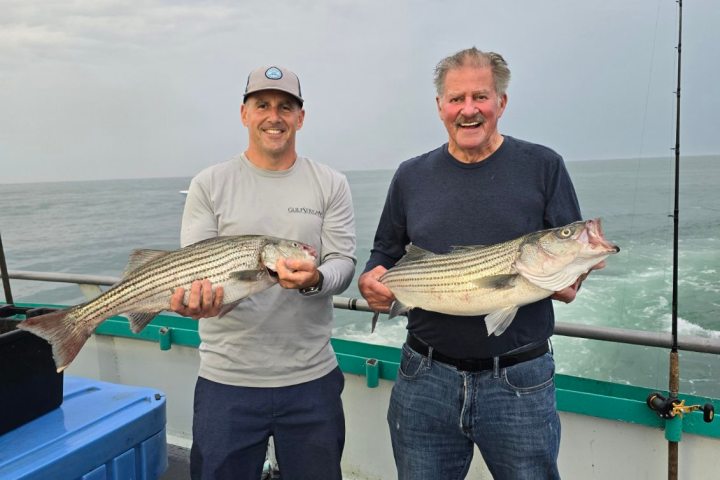 Mike Birkbeck holding a fish in the water