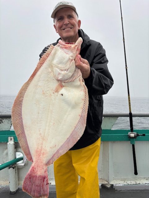 a person holding a fish