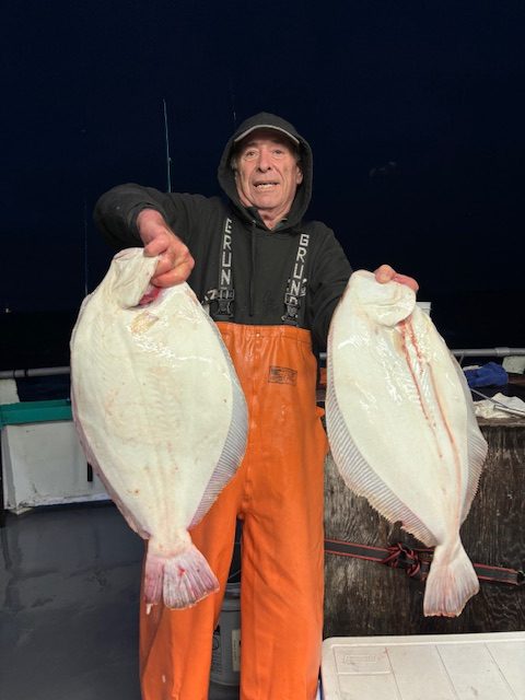 a person holding a fish